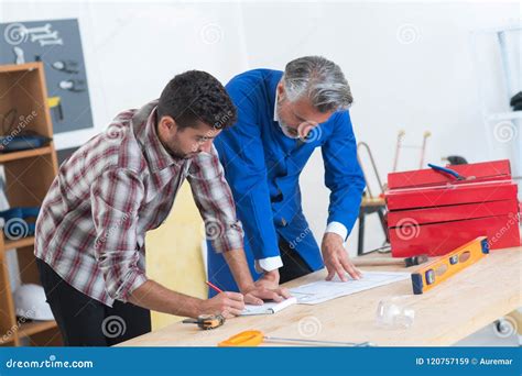 Mason and Engineer Measuring Plans Stock Image - Image of blueprints, plan: 120757159