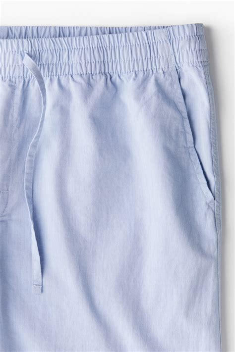 Men’s Light blue Relaxed Fit Poplin trousers | H&M IN