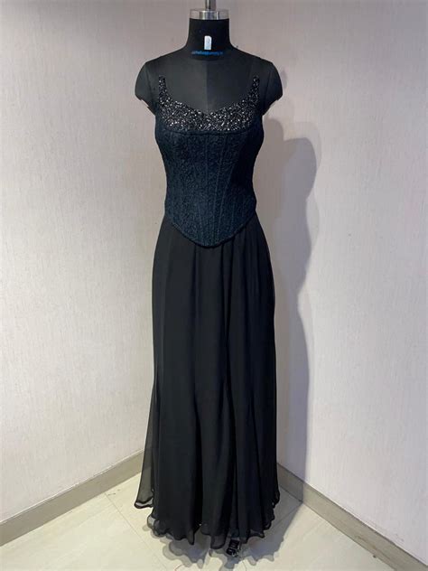 BLACK CORSET CAPE SET WITH FISH CUT SKIRT. – K.Anshika