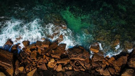 Aerial shots of the turquoise water, reef formations, beach and shipwreck at Henrietta Rocks.