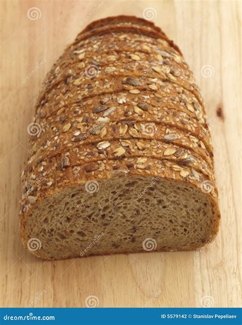 Multiseed Bread on Wooden Board Stock Photo - Image of wooden, cutting ...