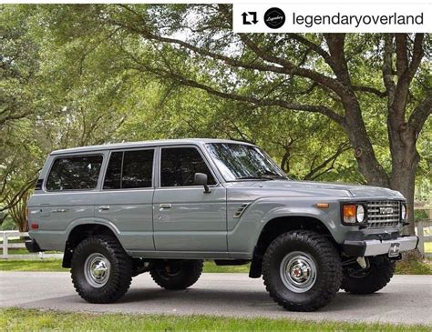 60 Series Land Cruiser SUV Parked Next to a Tree