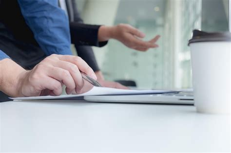Cropped hand of computer programmers brainstorming in office | Premium ...
