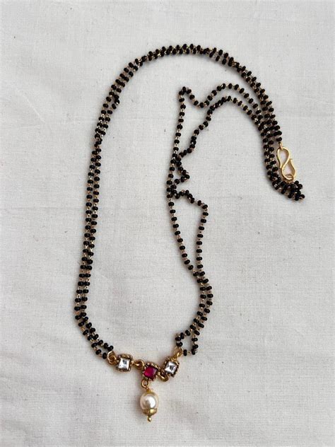 Gold polish black bead mangalsutra/tali style pendant chain | House of ...
