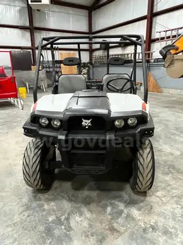 UTV with manual dump bed. | AllSurplus