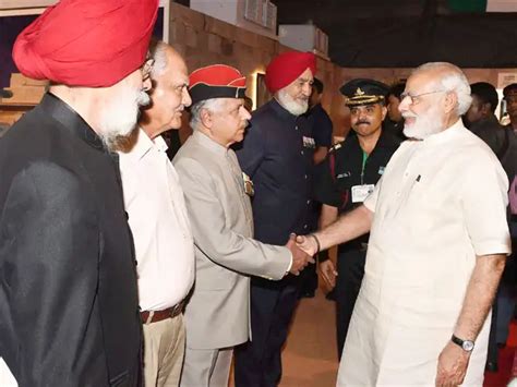 PM Modi with Rajnath Singh - PM Narendra Modi visits exhibition to mark ...