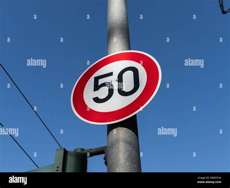 50 kmh speed limit sign on a pole. The traffic sign forbids car drivers ...