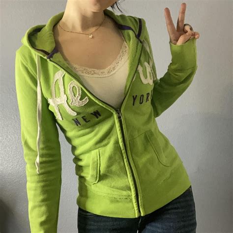 Green graphic y2k zip up hoodie from... - Depop | Fashion outfits ...