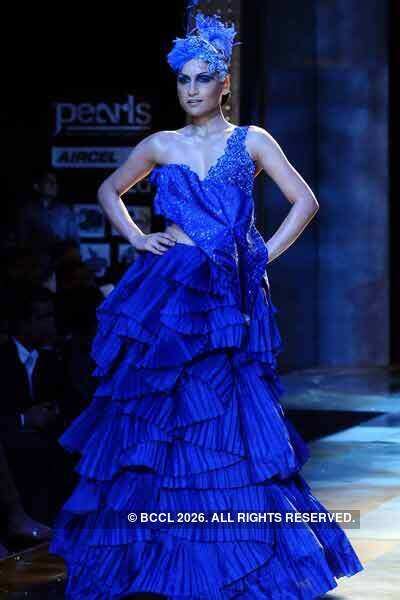 Indrani presents a creation by designer Manav Gangwani during Day-3 of ...