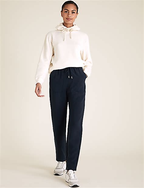 Buy Tencel™ Rich Tapered Ankle Grazer Trousers at Marks & Spencer