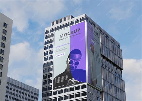 Premium PSD | Billboard mockup on tall building on the street