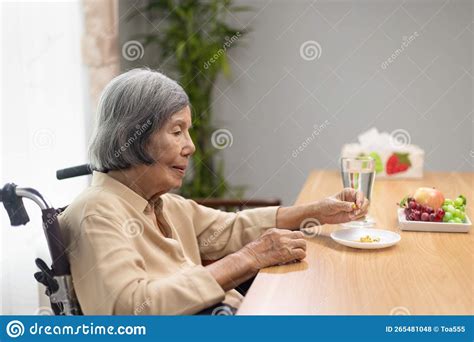 Elderly Woman Taking Fish Oil Supplements after Lunch Stock Photo - Image of elderly, aging ...