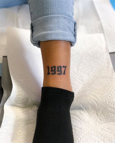 finger tattoo birth year