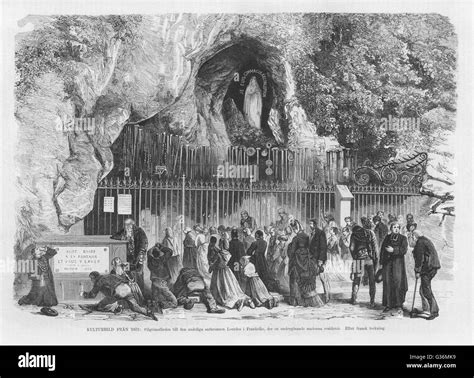 Drinking holy water at the Lourdes Grotto Stock Photo - Alamy