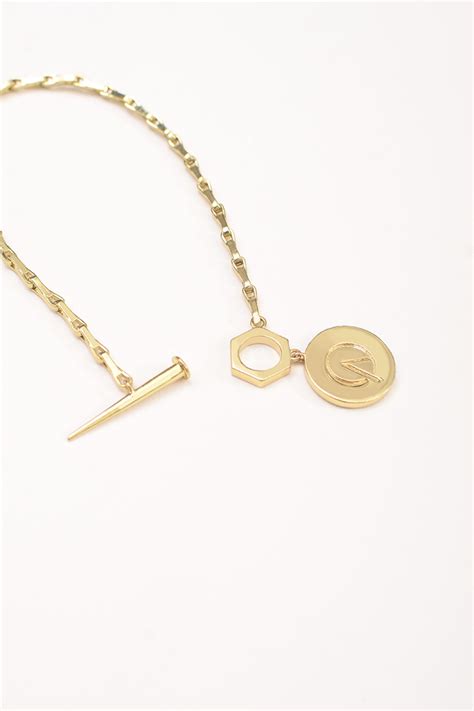 MEDALLION MONOGRAM LOCK BRACELET – Arqa India