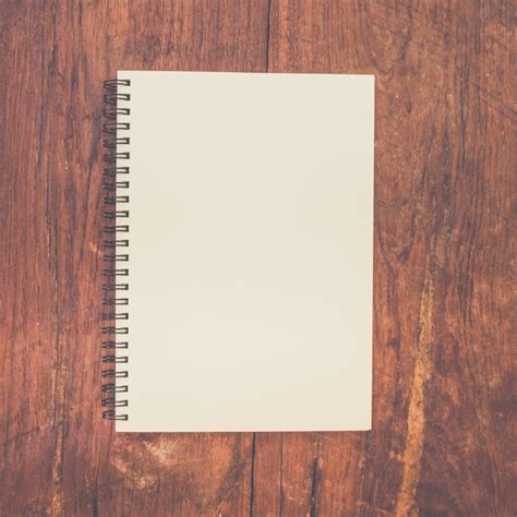 Brown book paper on wood table. | Premium Photo