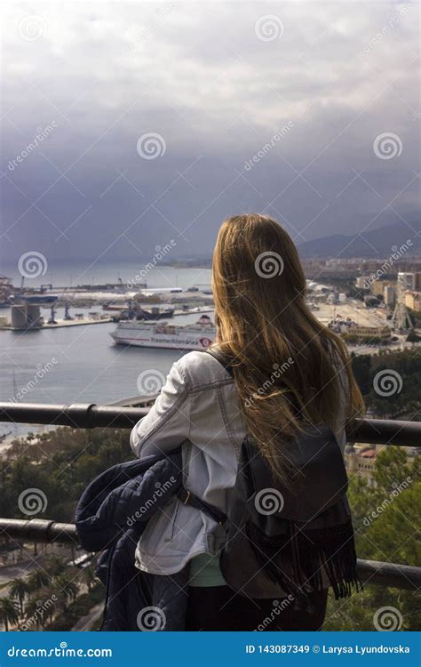 A Lonely Girl Stands on a Hill and Looks at the Beautiful Panorama of ...