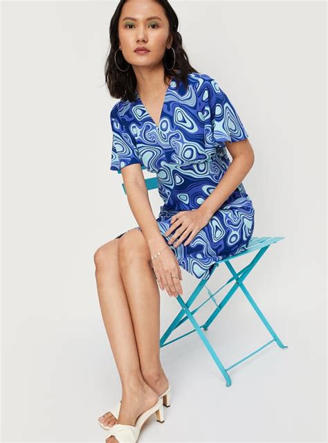 Buy Women Printed Flutter Sleeves Wrap Dress Online at just Rs. 999.0 ...
