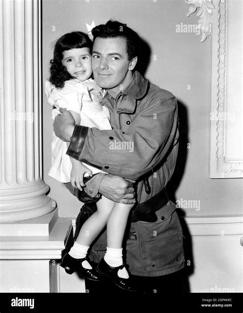 IT HAD TO BE YOU, Cornel Wilde, holding bit player Mary Jane Saunders ...