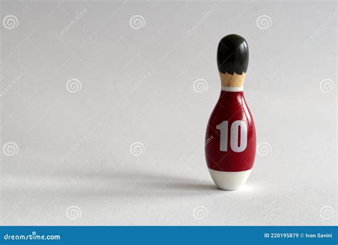 Rearview of a Wooden Puppet in the Shape of a Bowling Pin with a Number ...