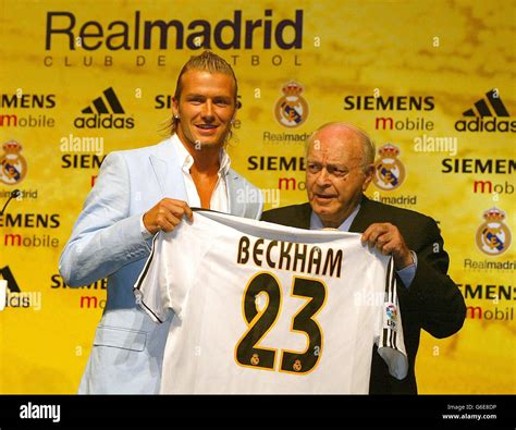 David Beckham (left) holds his new number 23 Real Madrid shirt ...