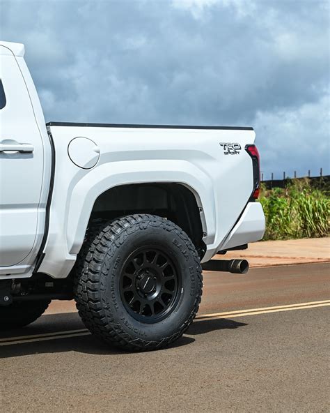 The Simplicity of a White and Black Ride Is Best Exemplified With a Lifted Toyota Tacoma ...