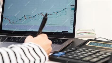 On computer monitor graph of price movement in form of green and red ...