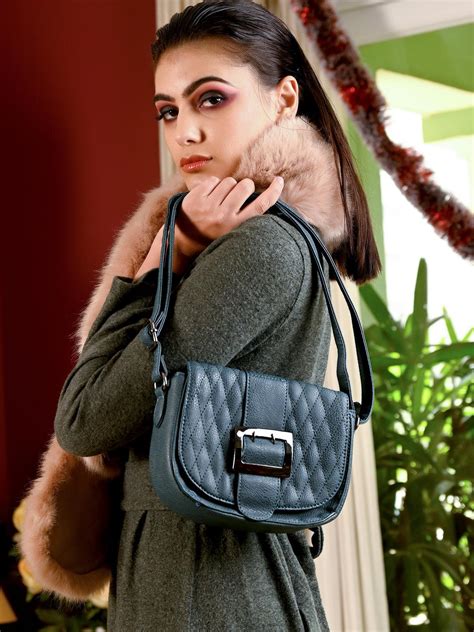 Buy Classic green textured sling bag for women Online. – Odette