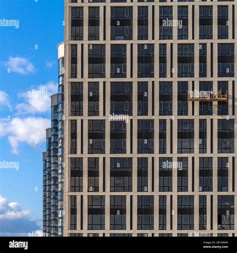 Modern high-rise buildings opposite a clear blue sky in perspective ...