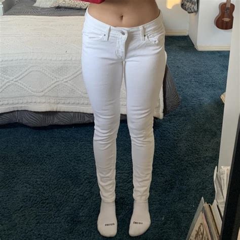 white low rise levi's size 27 white skinny jeans... - Depop