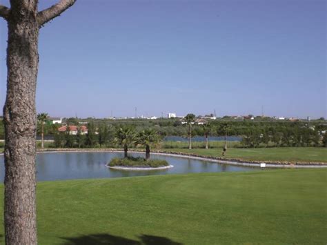 https://getawaygolfer.com/wp-content/uploads/2023/12/Las-Minas-Golf-Club-Lake.jpeg
