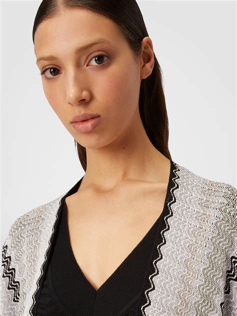 Poncho in viscose blend knit with wave pattern and fringes