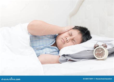 Child Lying Down Suffering from a Headache. Stock Image - Image of hand, asleep: 88973891