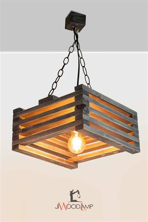 a wooden light fixture hanging from the ceiling