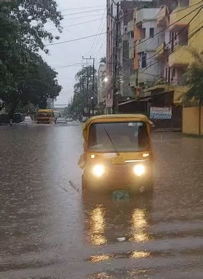 Knee to chest-deep rainwater cripples city life, trains halt, shops ...