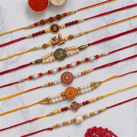 eCraftIndia Set of 9 Shri, Rudraksha, Flower, Peacock, Om, Beads, Pear
