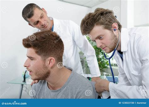 Internist Doctors During Stomach Examination Stock Image | CartoonDealer.com #123288391