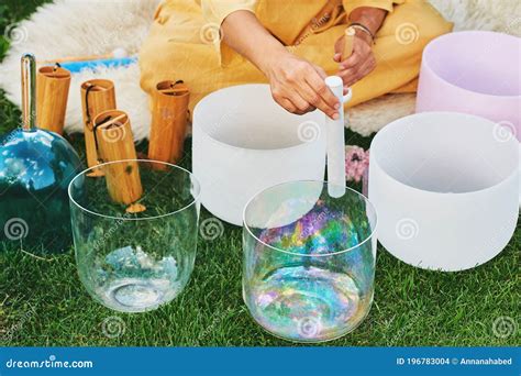 Woman Playing Music on Crystal Singing Bowls Stock Photo - Image of ...