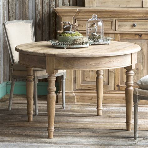 This Park Hill Rustic Round Dining Table features elegant round form ...