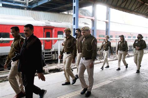 Delhi Police and RPF personnel patrol Platform No. 14 following a ...
