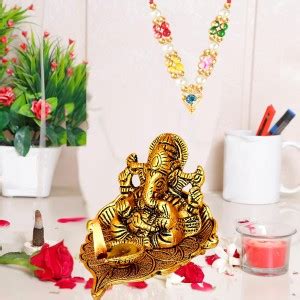 NOKTUS ganesh idol sitting on leaf with diya, jyoti, deepak oil lamp ...