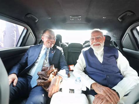 Modi, Malaysia’s Anwar share ride from airport to community meet
