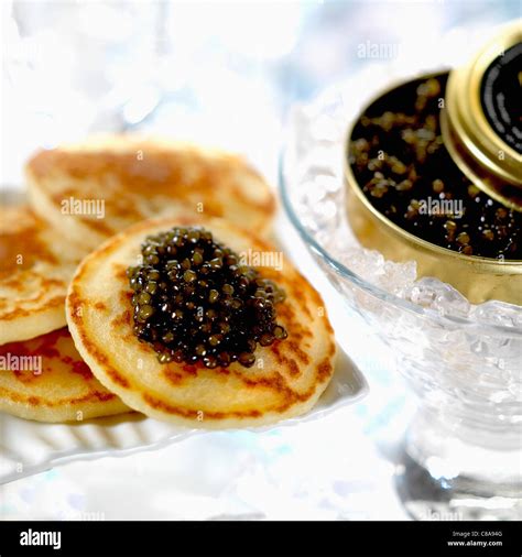 Mini blinis with caviar Stock Photo - Alamy