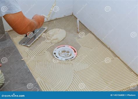 Spreading Wet Mortar before Applying Tiles on Bathroom Floor Stock ...