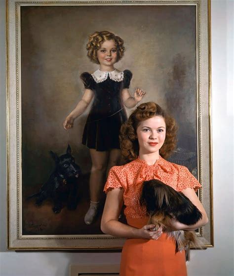 Shirley Temple posing by a painting of young Shirley Temple. 1945 : r ...