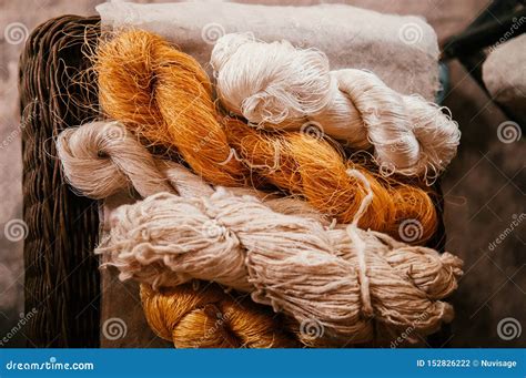 Natural Yellow Silk Thread and Cotton Fiber Rolls Stock Photo - Image ...