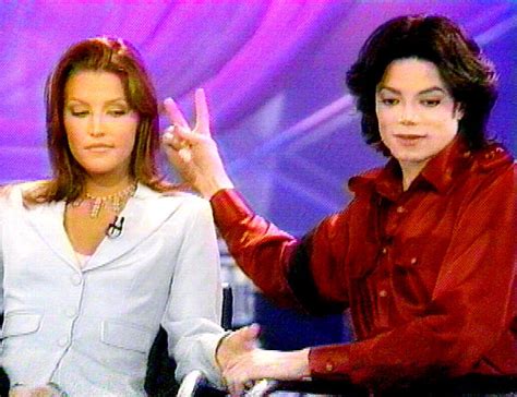 Michael Jackson with his wife Lisa Marie Presley during a live ...