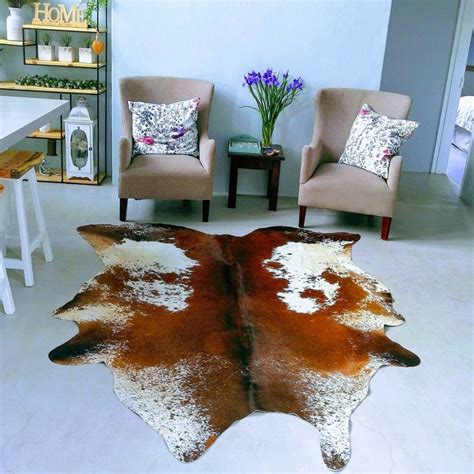 https://ngunicowskins.com/wp-content/uploads/2024/10/Nguni-Cow-Skin-Hide-in-Living-Room-1024x1024.jpg