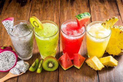 Mix Fruit juice in a glass with fresh fruits 22453370 Stock Photo at ...