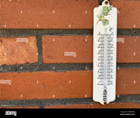 Wooden thermometer on brick hi-res stock photography and images - Alamy